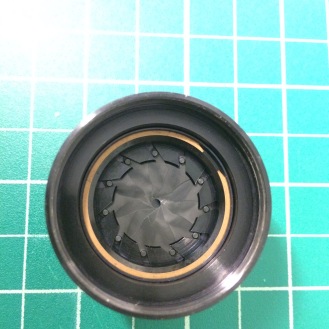 If you want to clean the aperture blades (They were very oily in my lens), remove the brass retaining ring