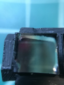 Whatever solvent their paint is based on, it attacked the NOA85V adhesive and ruined my coating. You can clearly see that the solvent worked its way between the prisms
