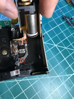 Gently lift the motor assembly and undo those two screws